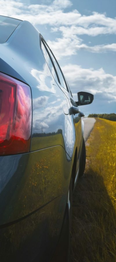 Travel by car. The car parked on the roadside